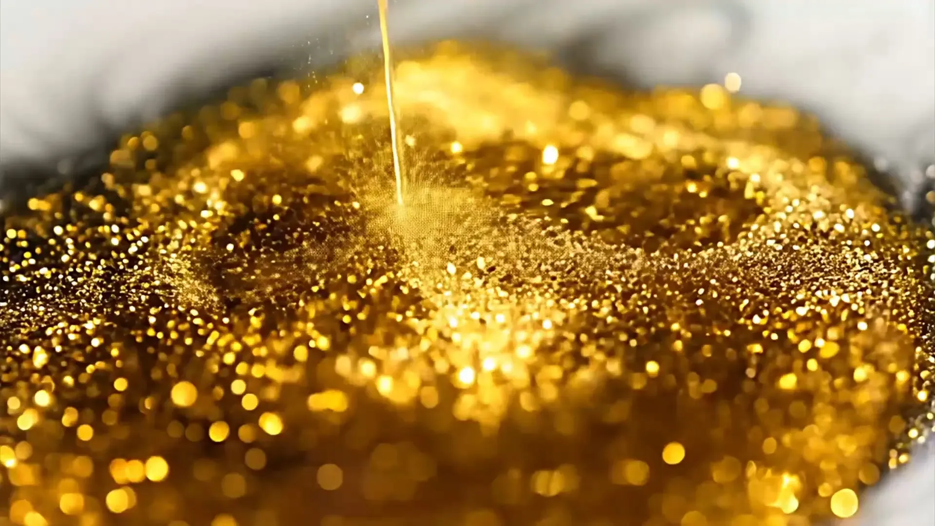 Luxurious Golden Glitter Rain Background for High-End Fashion Videos